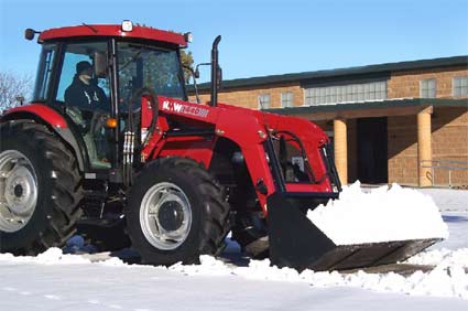 KMW 1440 Tractor removing snow.